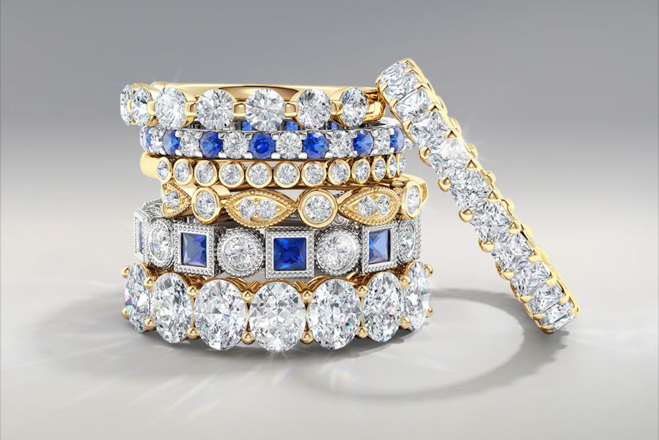 Stack of diamond and sapphire anniversary bands