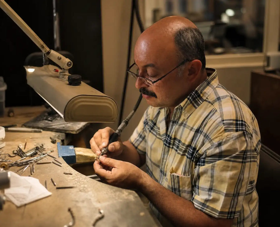 Custom jewelry being handcrafted at the Lustig workbench