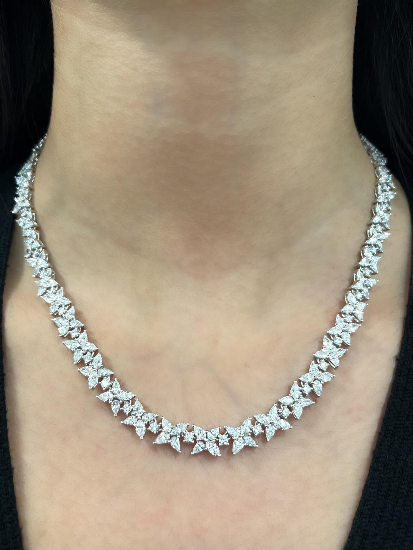 Graduated diamond tennis necklace worn on the neck