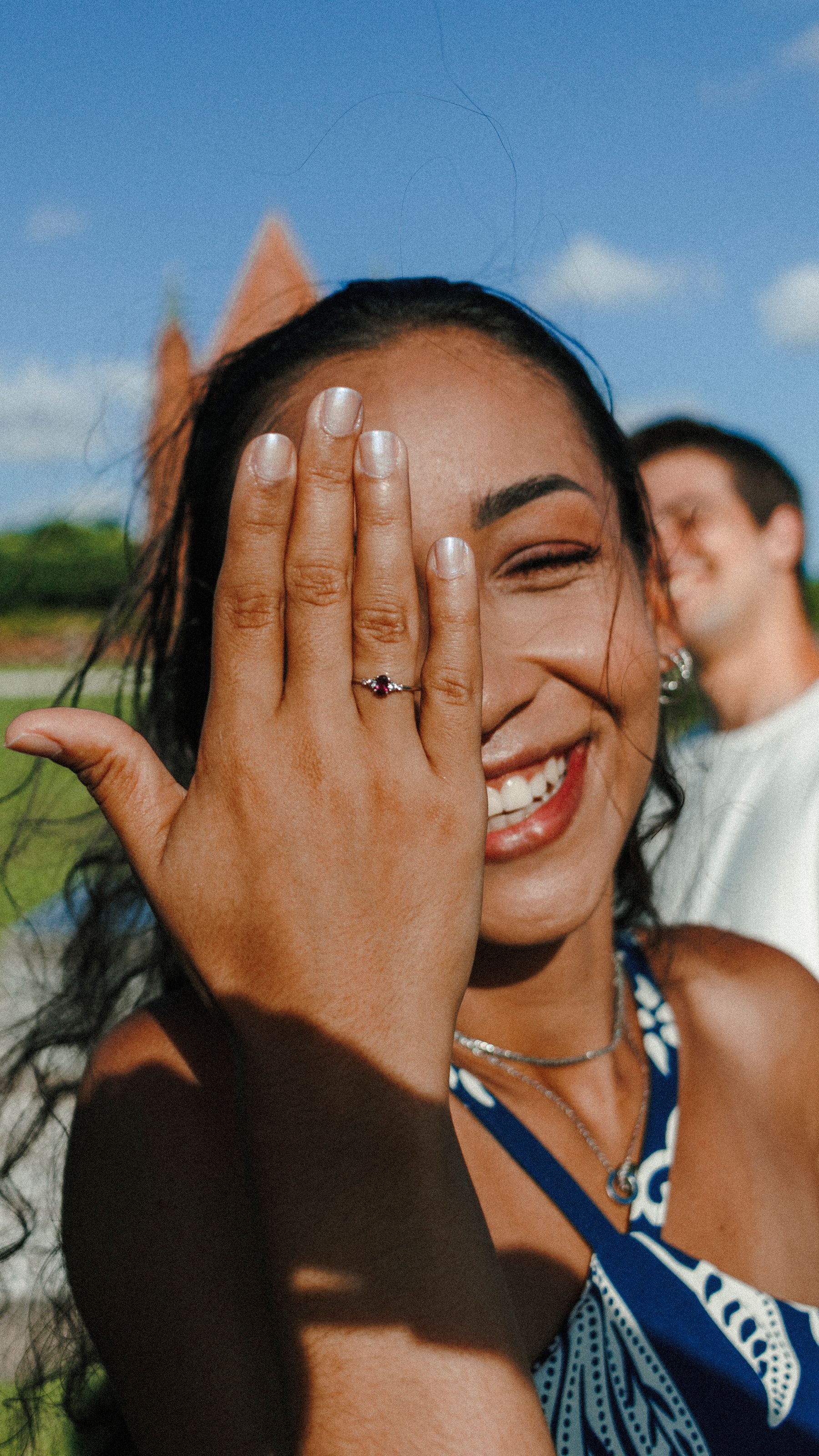 Woman joyfully showing her engagement ring