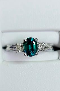 White gold diamond engagement ring with emerald center 