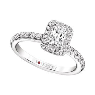 White gold engagement ring with emerald center