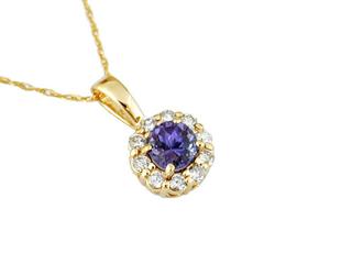 Yellow gold diamond pendant with tanzanite center