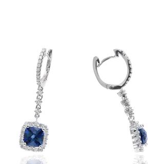  White gold earrings with a diamond halo around a blue topaz center