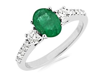 White gold diamond ring with oval emerald center