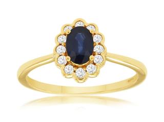 Yellow gold diamond ring with oval sapphire center